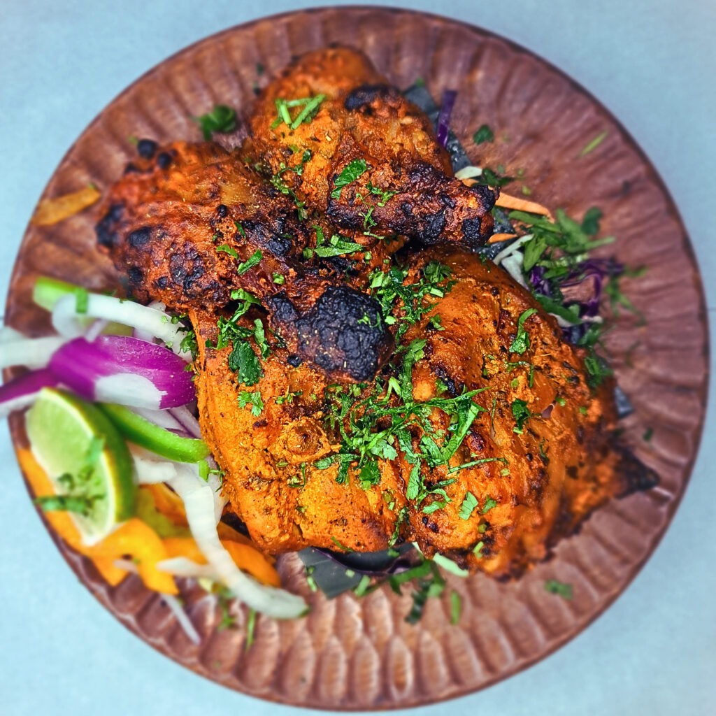 Tandoori Chicken on a wooden platter